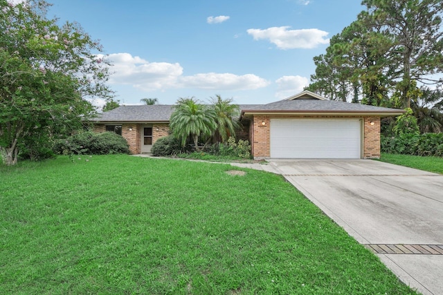 ranch-style home featuring a front yard and a garage