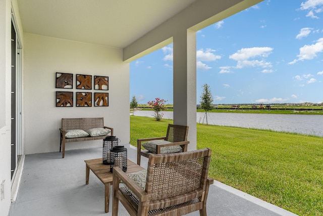 view of patio with a water view