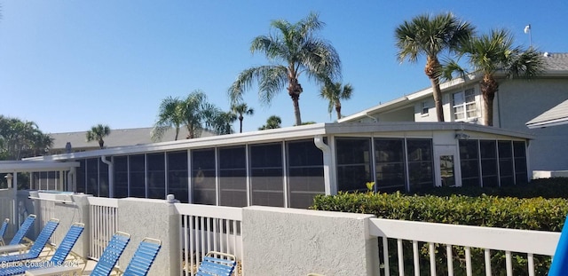 exterior space featuring a sunroom