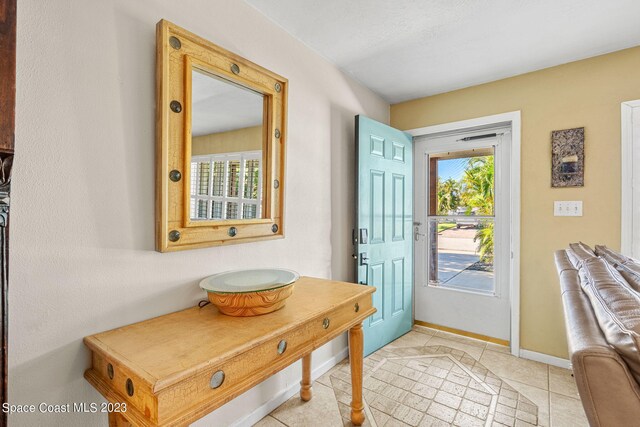 entrance foyer with light tile patterned floors