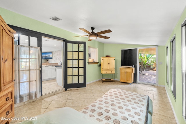 interior space featuring connected bathroom, ceiling fan, and access to exterior