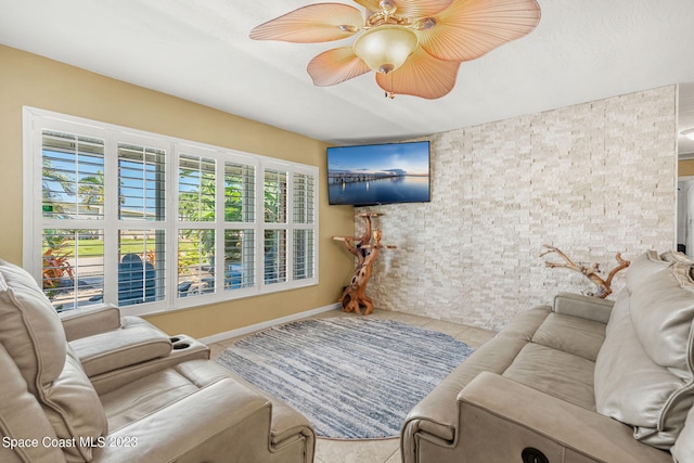 tiled living room with ceiling fan