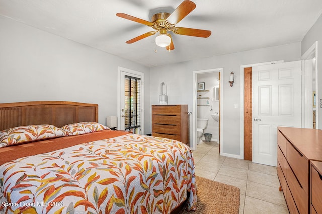 bedroom featuring ceiling fan, light tile patterned flooring, and ensuite bathroom