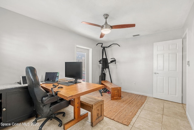 office space featuring light tile patterned floors and ceiling fan