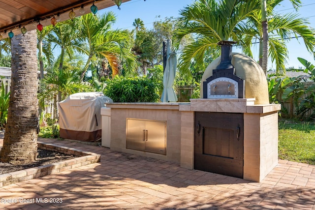 view of patio featuring grilling area and an outdoor kitchen