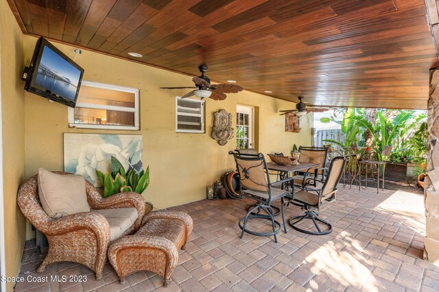 view of patio featuring ceiling fan