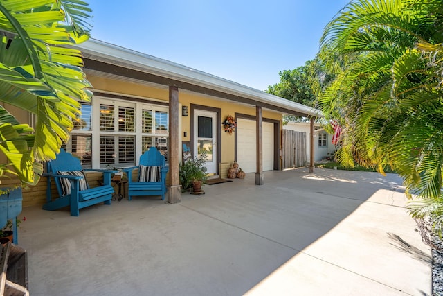 view of patio / terrace featuring a garage