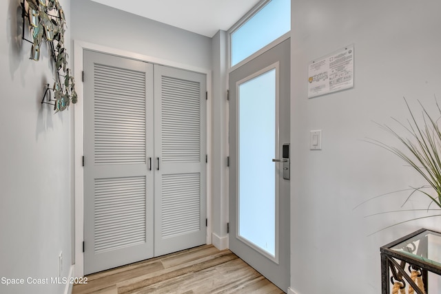 doorway to outside featuring light wood finished floors