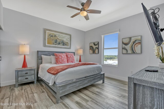 bedroom featuring ceiling fan and light hardwood / wood-style floors