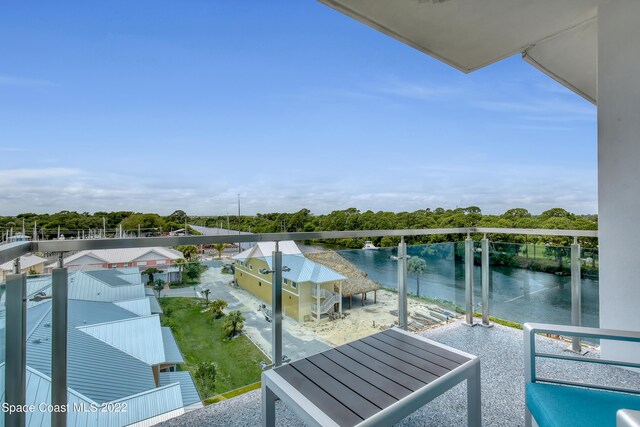 balcony featuring a water view