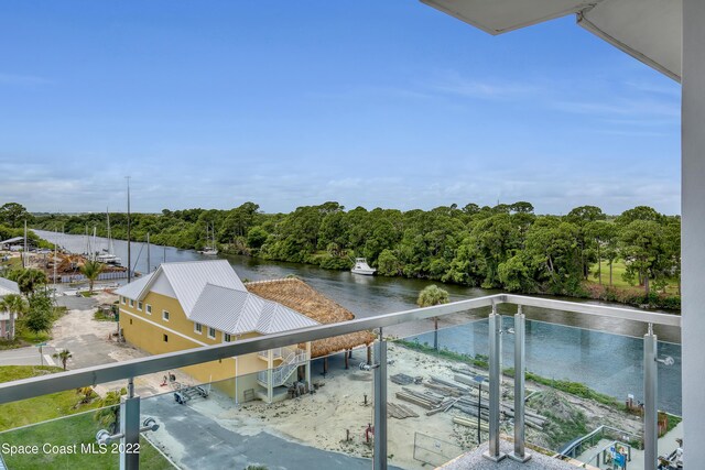 balcony featuring a water view