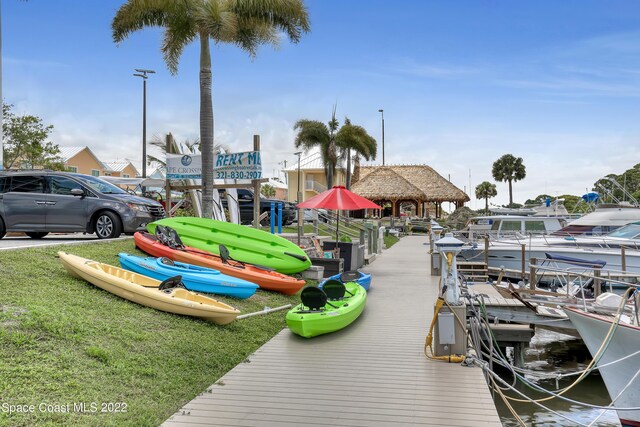 dock area featuring a lawn