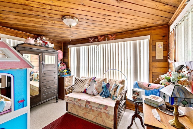 interior space with wooden walls, wooden ceiling, and carpet flooring