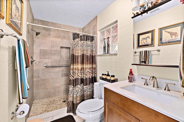 bathroom with a shower with curtain, vanity, toilet, and a textured ceiling