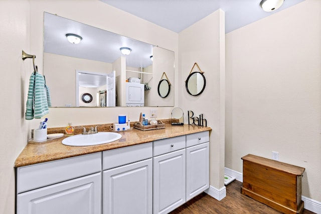 bathroom featuring vanity and wood-type flooring