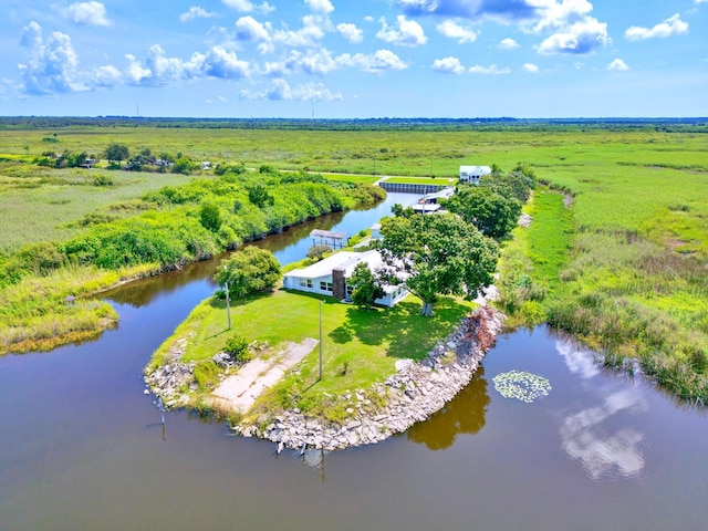 drone / aerial view with a water view and a rural view