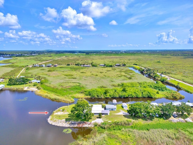 birds eye view of property featuring a rural view and a water view