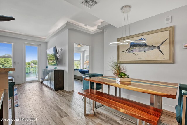 dining area featuring hardwood / wood-style flooring and plenty of natural light