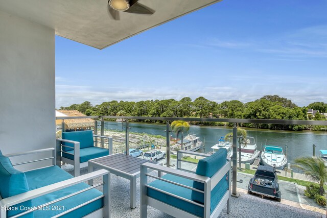 balcony featuring a water view