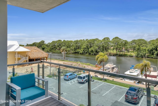 balcony featuring a water view