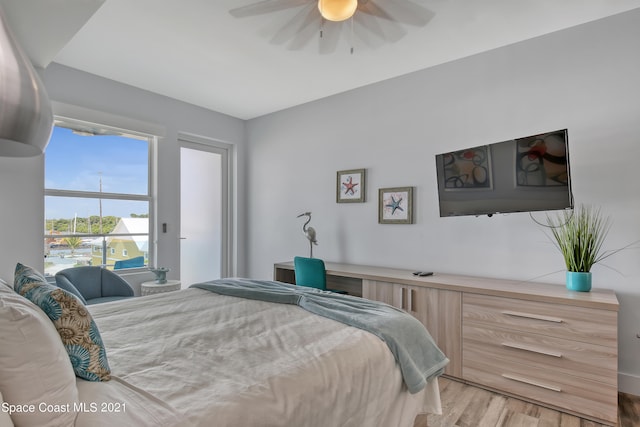 bedroom featuring ceiling fan and light hardwood / wood-style flooring