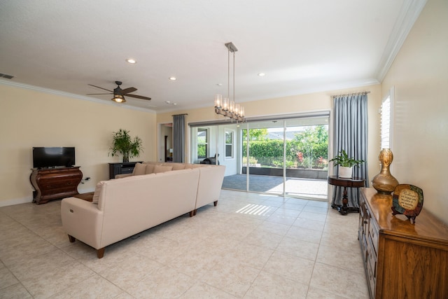 tiled living room with ceiling fan with notable chandelier and ornamental molding