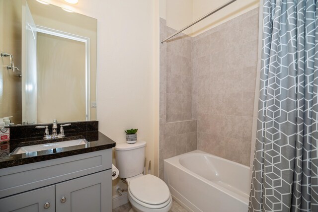 full bathroom with vanity, shower / bathtub combination with curtain, and toilet