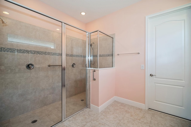 bathroom with tile patterned floors and an enclosed shower