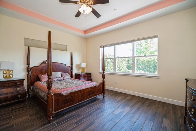 bedroom featuring dark hardwood / wood-style flooring and ceiling fan