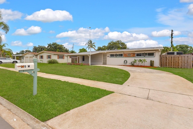 ranch-style home with a front lawn