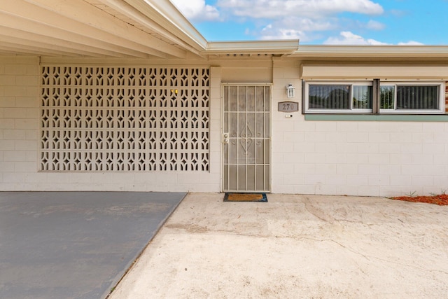 entrance to property with a patio area