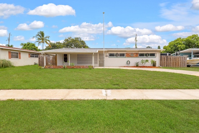 ranch-style house with a front lawn