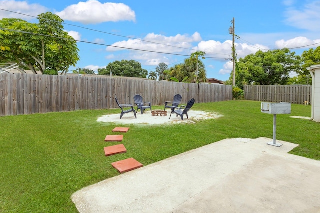 view of yard with a patio area and a fire pit