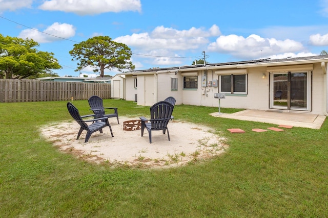 view of yard featuring a patio and an outdoor fire pit