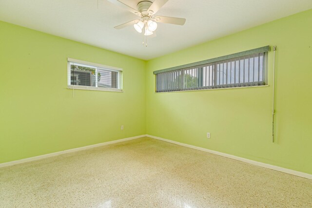 spare room with ceiling fan