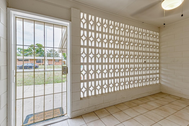 entryway with light tile patterned floors