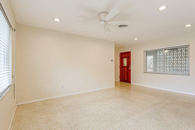 spare room featuring ceiling fan