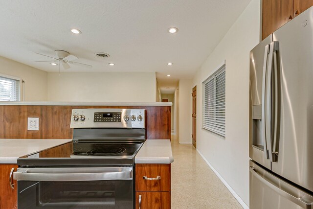 kitchen featuring ceiling fan and stainless steel appliances