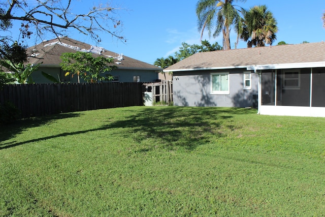 view of yard with a sunroom