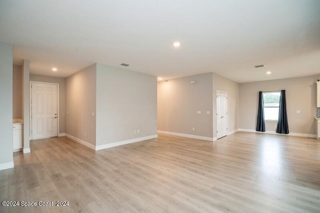 spare room featuring light hardwood / wood-style floors