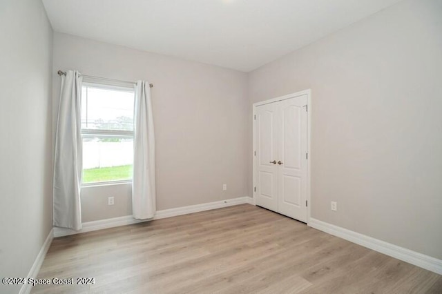 empty room with light hardwood / wood-style floors