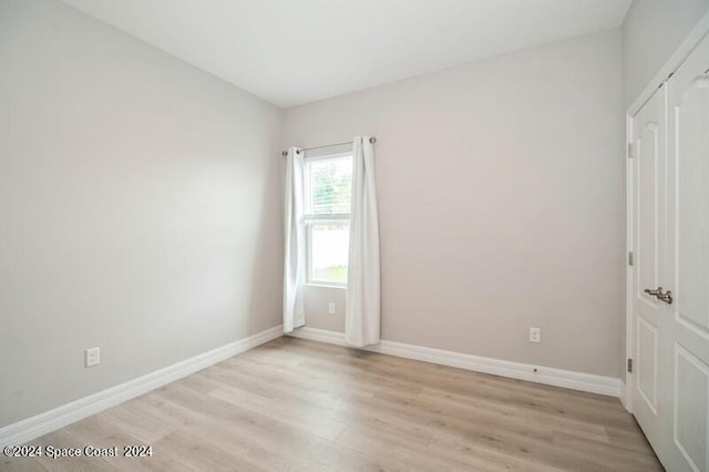 unfurnished room with light hardwood / wood-style flooring