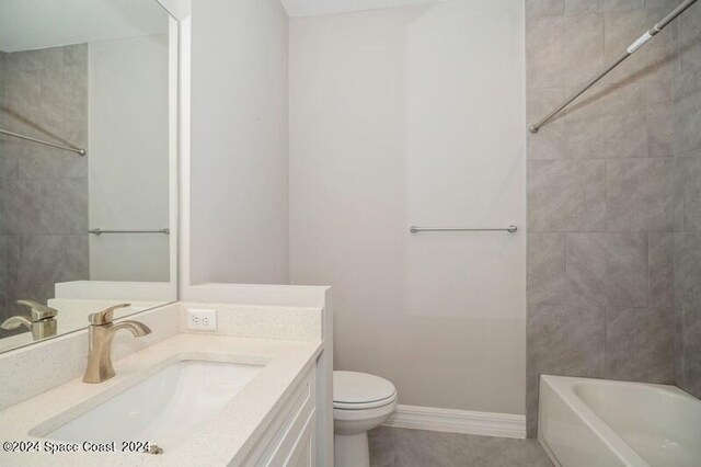 full bathroom featuring vanity, toilet, and tiled shower / bath combo