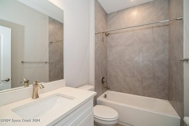 full bathroom with vanity, toilet, and tiled shower / bath combo