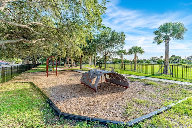 view of jungle gym with a lawn