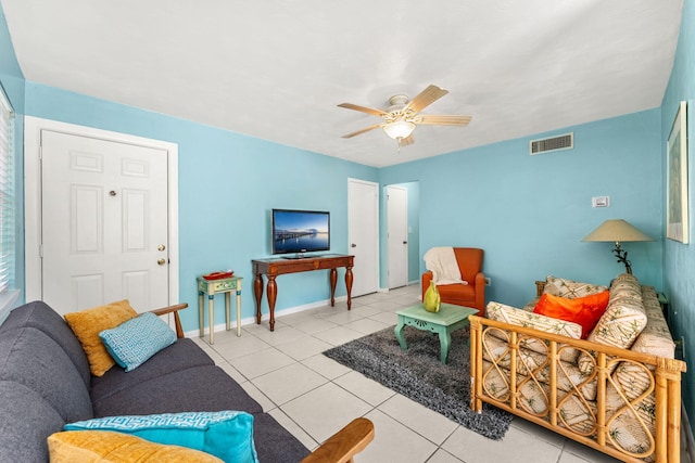 living room with light tile patterned floors and ceiling fan