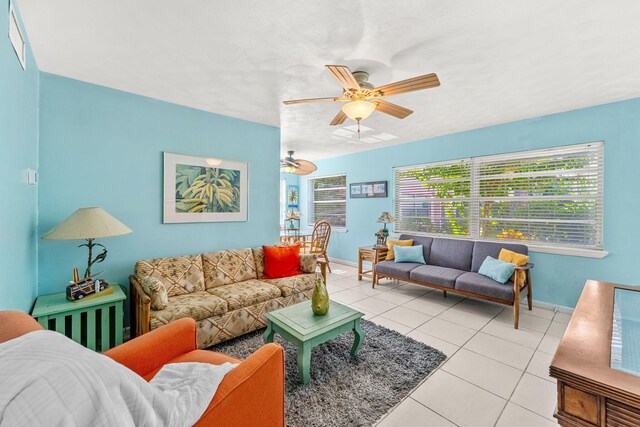 living room featuring light tile patterned flooring and ceiling fan