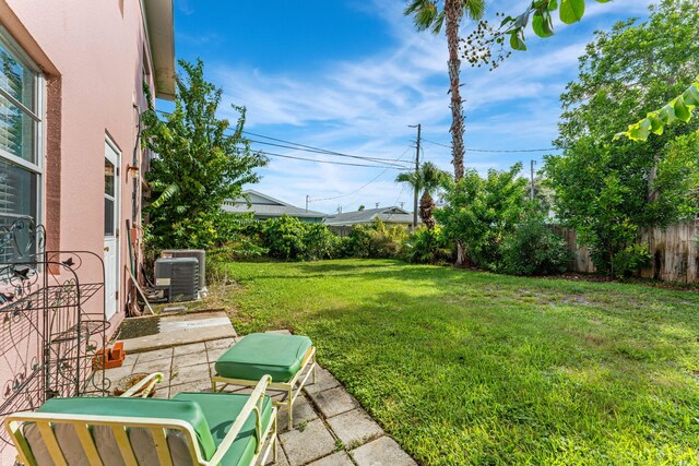 view of yard featuring a patio area and cooling unit