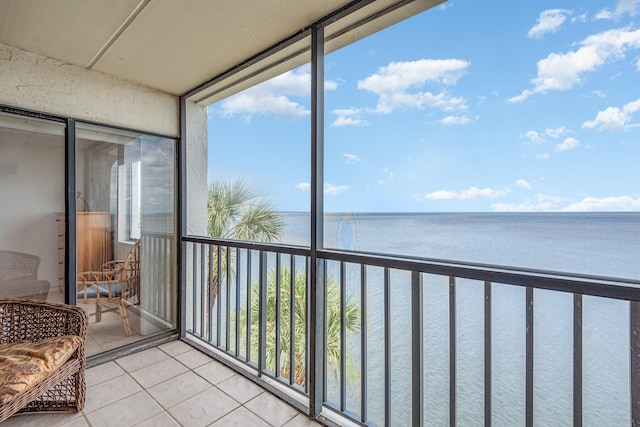 sunroom with a water view