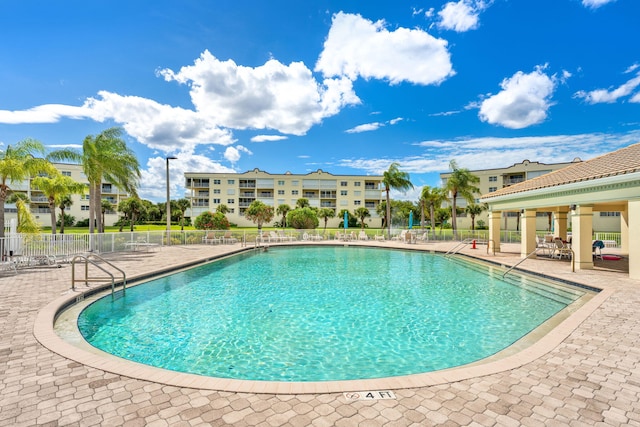 view of swimming pool with a patio area